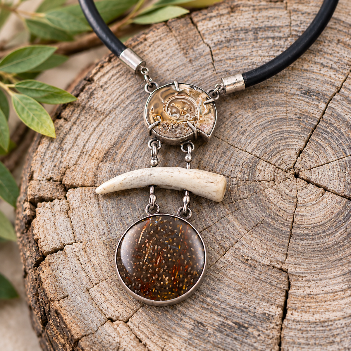 Bone and fossil shell pendant necklace with black cord and silver-tone hardware
