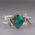 Turquoise inlay cuff bracelet with sterling silver prong and leaf accents