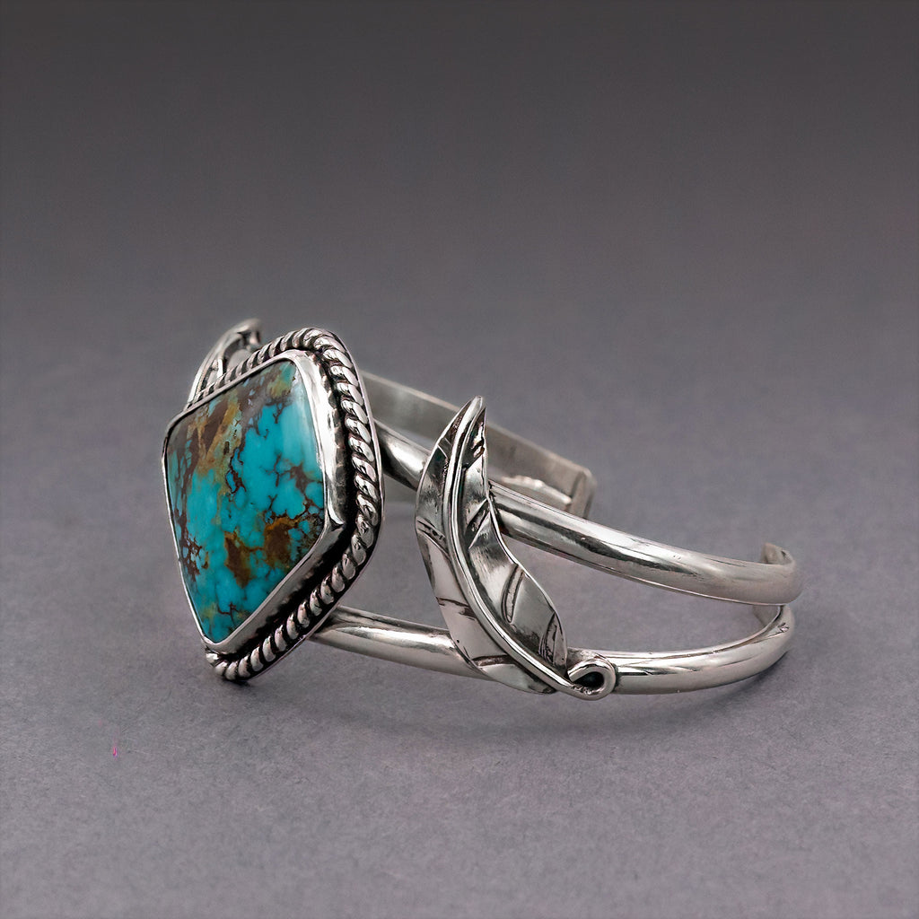 Turquoise bezel cuff bracelet in sterling silver with hinge-style open ends