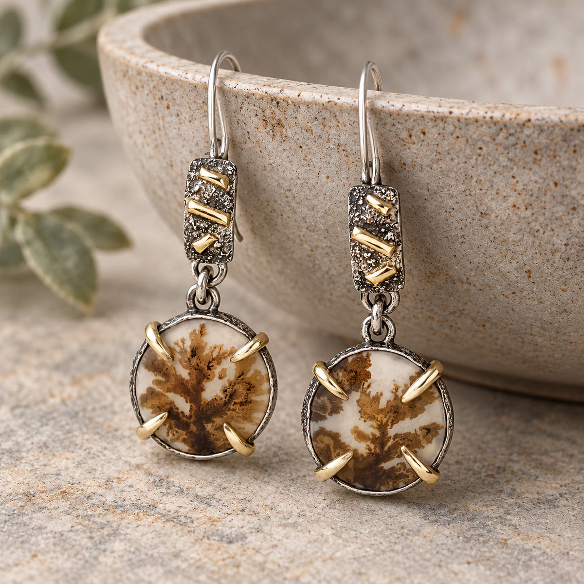 Dendritic agate earrings with round brown-and-white stones, silver settings, and gold accents