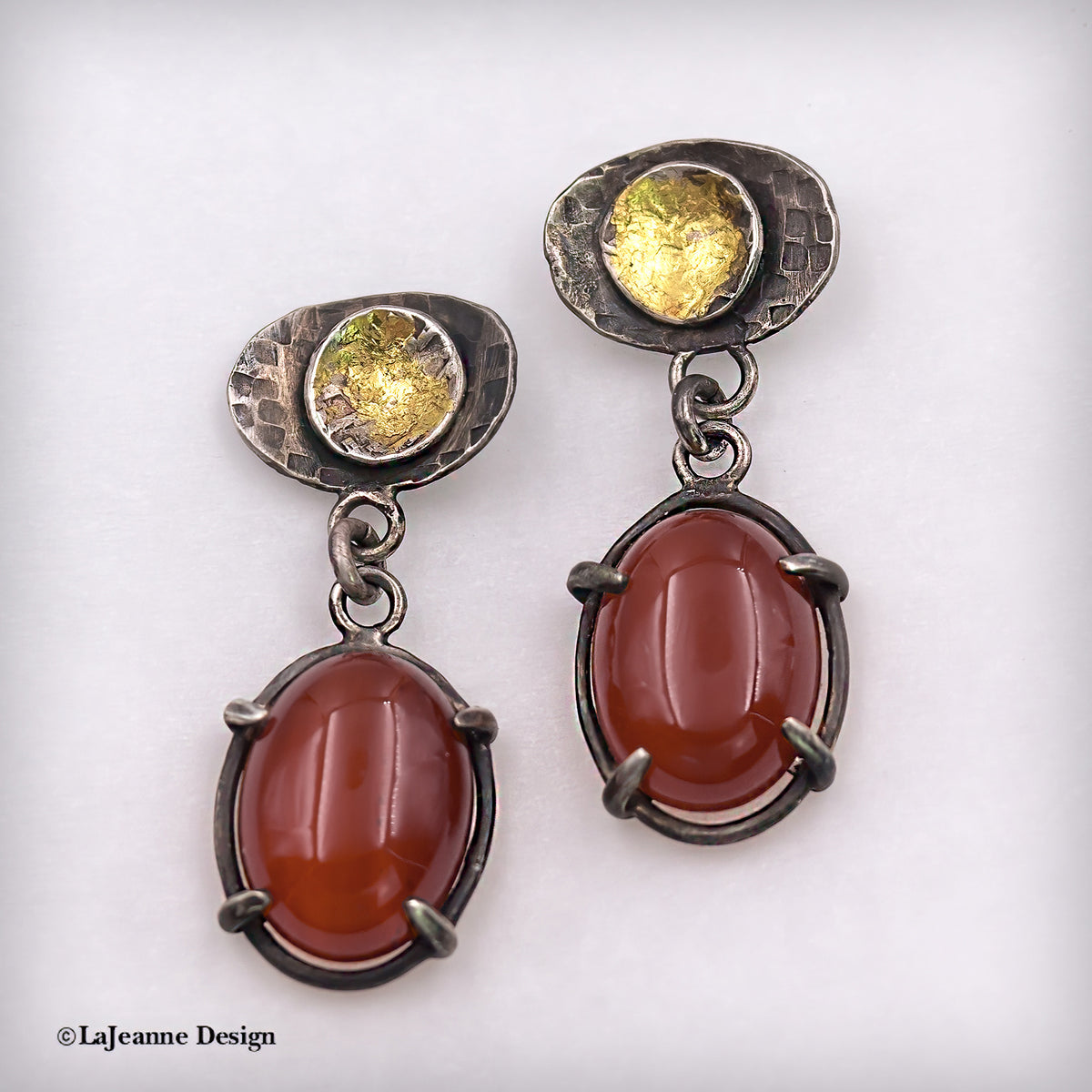 Carnelian and 24K sterling silver drop earrings with oval red stones and gold-toned accents