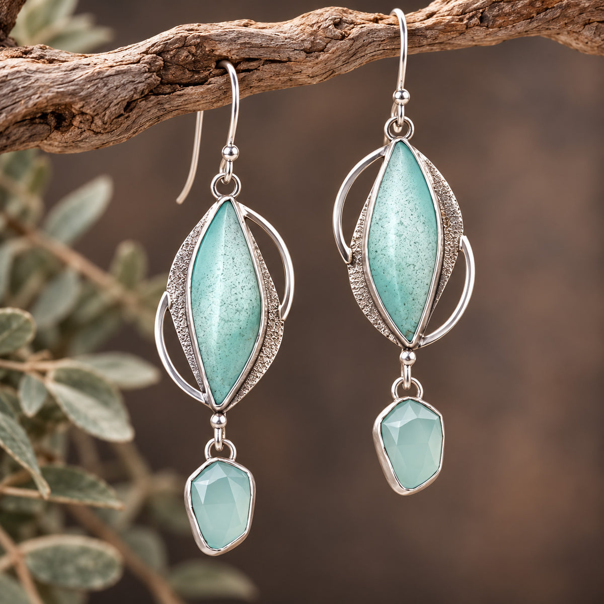 Sterling silver earrings with blue opalized wood and chalcedony stones in an ornate drop design