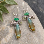 Sterling silver drop earrings with green stones, textured accents, and long, banded teardrop gems