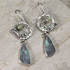 Sterling silver earrings with peridot green round stone and blue opalized wood drop
