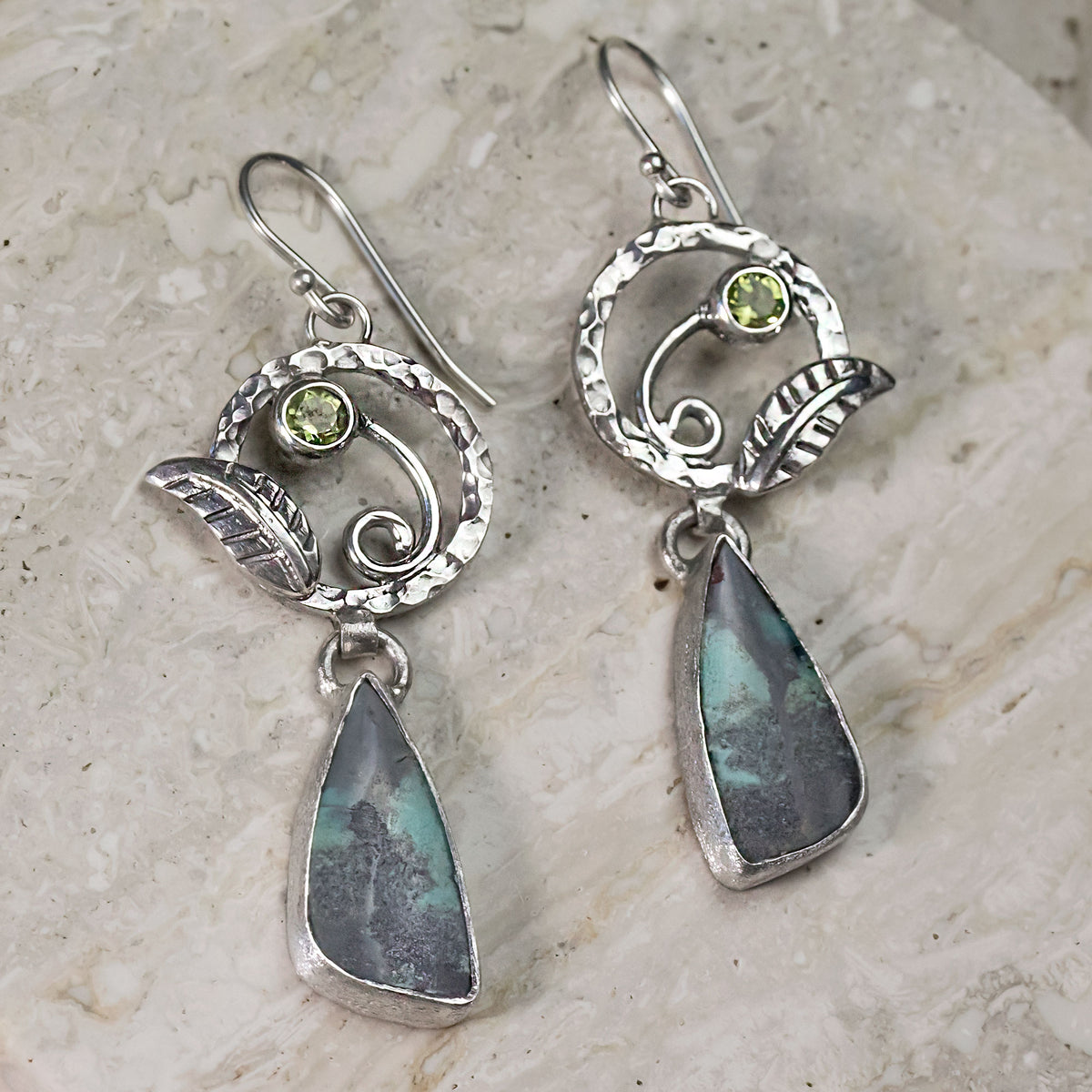 Sterling silver earrings with peridot green round stone and blue opalized wood drop