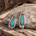 Turquoise teardrop dangle earrings in sterling silver with hinged oval frames