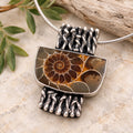 Sterling silver necklace with rectangular ammonite fossil pendant, brown spiral in bezel