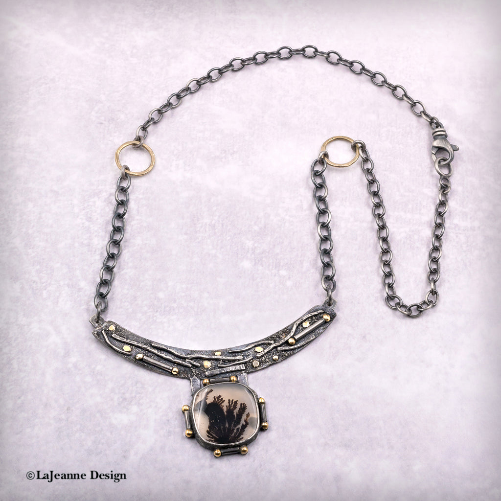 Dendritic agate pendant necklace with curved crescent bar and framed cabochon, chain view