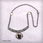 Dendritic agate pendant necklace with curved crescent bar and framed cabochon, chain view