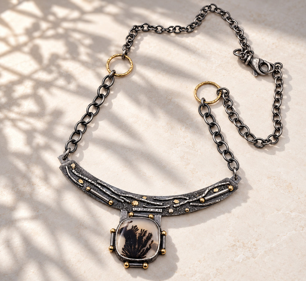 Sterling silver necklace with dendritic agate oval pendant and gold-tone bezel