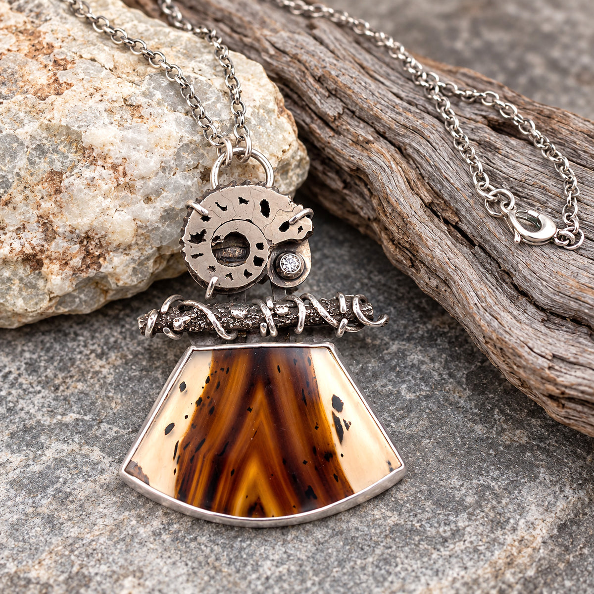 Sterling silver necklace with large teardrop pendant and bronze tiger-eye stone, gear charm