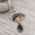 Sterling silver necklace with oval eye jasper drusy pendant and black teardrop stone charm