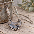 Sterling silver necklace with teardrop agate pendant and small citrine accents, link chain