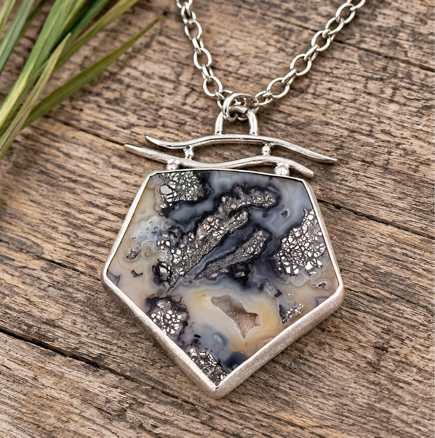 Sterling silver necklace with hexagonal black agate pendant and marcasite detail