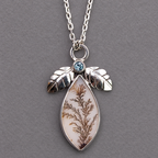 Sterling silver necklace pendant with blue topaz bezel and dendritic agate teardrop