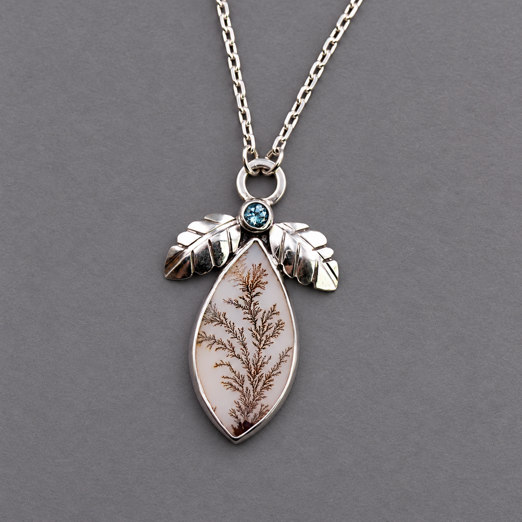 Sterling silver necklace with teardrop pendant, dendritic agate center and blue topaz