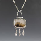 Silver necklace pendant with dendritic agate stone and dangling feather charms