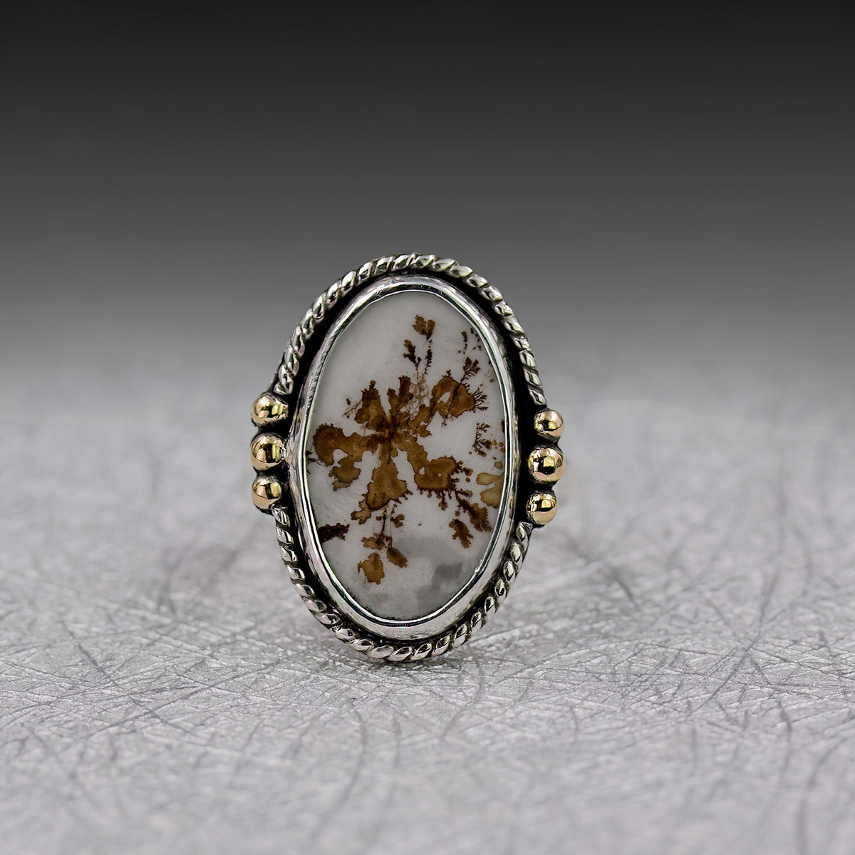 Oval dendritic agate ring with sterling silver rope bezel and 18k gold side beads