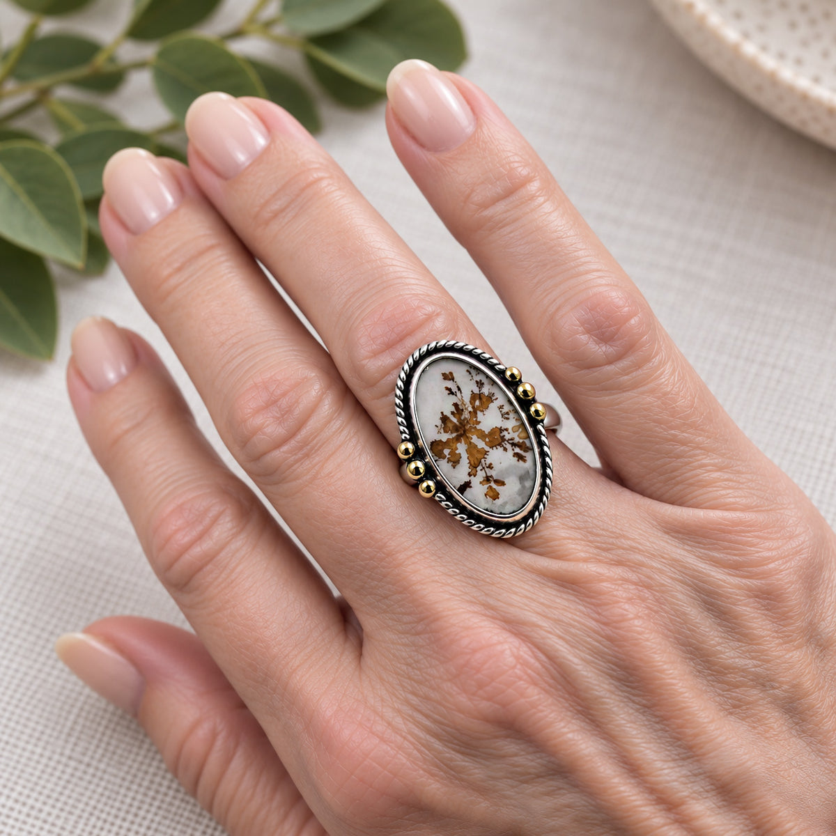 Dendritic agate oval ring in sterling silver with 18k gold bead accents, on hand