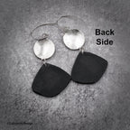 Black polymer clay drop earrings with silver disc caps and silver hoop hooks