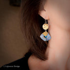 Silver hoop dangle earrings with gold-tone cap and blue polymer clay drop